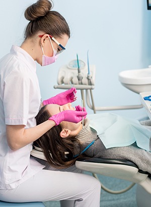 A hygienist doing a dental cleaning
