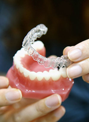 dentist pointing to implant example