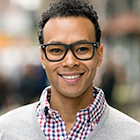 man in glasses smiling