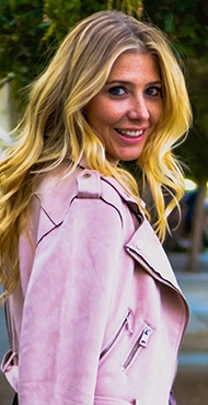 woman in pink moto jacket